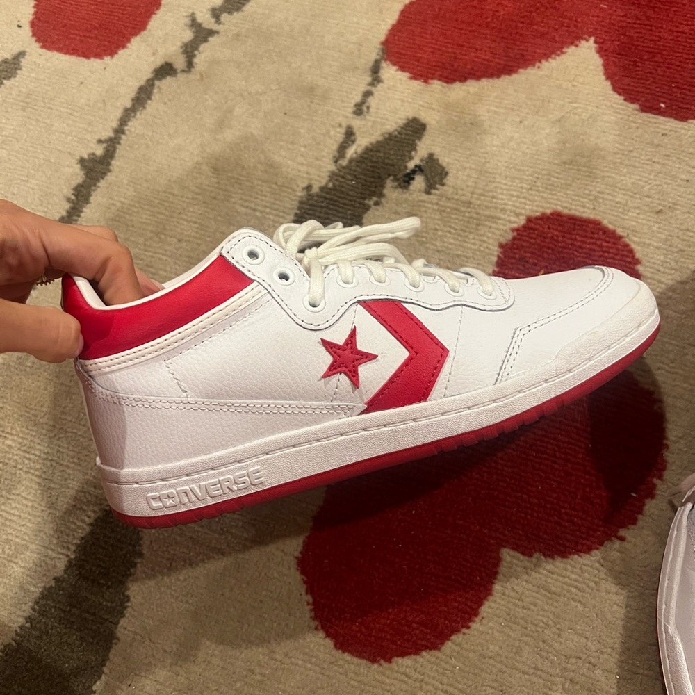 Red and white converse cons